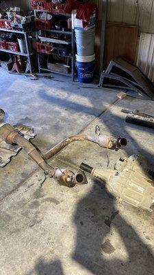 The exhaust, driveshafts, and transfer case that needed to be removed.