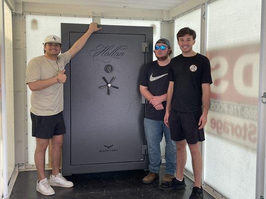 At Your Service moving Large safe into from pod in garage