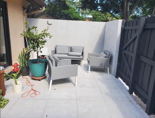 As you can see, the lines are all perfect, tiles are level.  The reinforced concrete edge is hidden beneath that small strip of cut pavers.