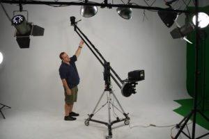 Dean working on set with our 6 foot Jib arm with the white background in use.