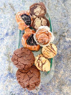 Assorted cookies, scones, pastries, and muffins.