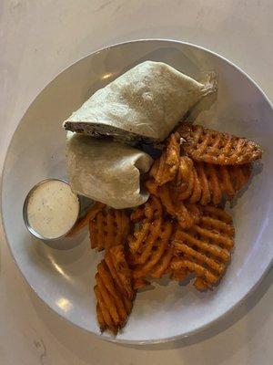 Hummus wrap and sweet potato waffle fries.  The waffle part was a surprise but in a good way.  Lots of garlic in the wrap.  Vampires beware.