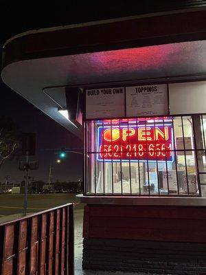 Neon open sign in window