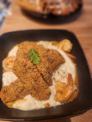 Seafood grits gumbo with crab meat shrimp and fish