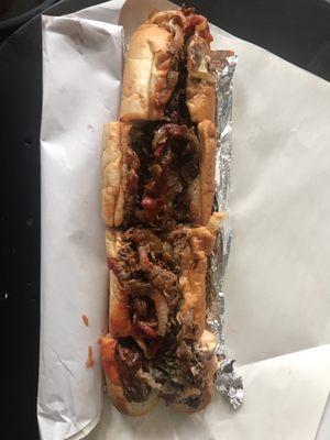 Philly cheese steak with fried onions, hot & sweet peppers and ketchup.