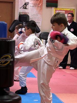 Our Fall Kids Class punching and kicking the bags!