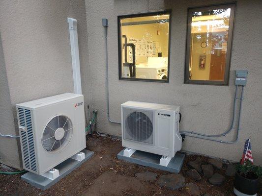 Mitsubishi Heat Pump for HVAC on the left.  Sanden Co2 Chemical Free Heat Pump Water Heater