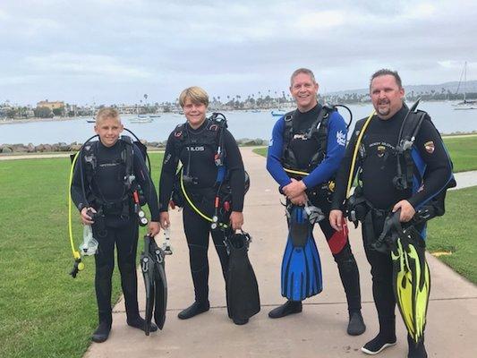 Happy group of divers about to go out with San Diego Scuba Pros