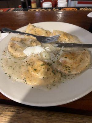 Pirogies in garlic butter sauce