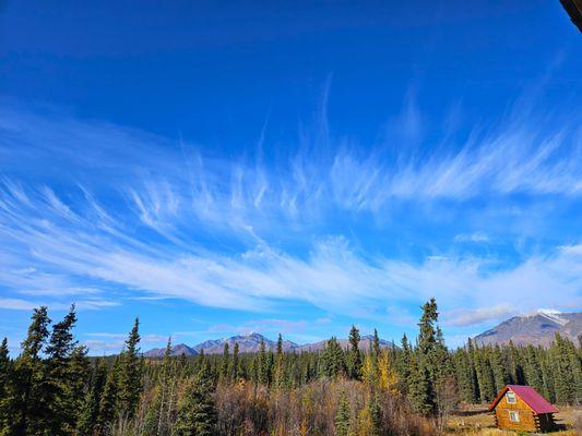 Raven Cabin and the Mentasta Mountains on a sunny autumn day in Wrangell-St. Elias National Park & Preserve