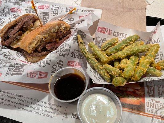 Tenderloin Steak Sandwich with grilled onions and Tempura Green Beans, Teriyaki sauce and ranch dressing.