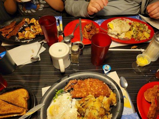 We ordered the Corned Beef Hash and Eggs, Country Benedict and French Toast. The extra crispy sides of bacon are perfectly cooked.