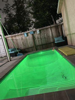 At night we turn on the pool light. sometimes blue, sometimes white, this time green.