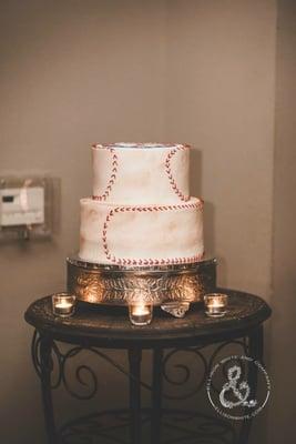 Side view of the grooms cake! Love the detail and how they made the cake look "dirty" like a true baseball!