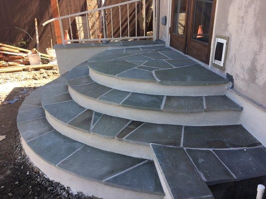 Flagstone steps, shaped in a hald circle.