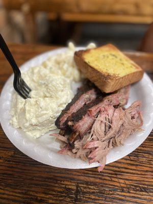 Ribs and Pork combo with Southern Potato Saladand Creamy Mac 'N' Cheese and garlic bread