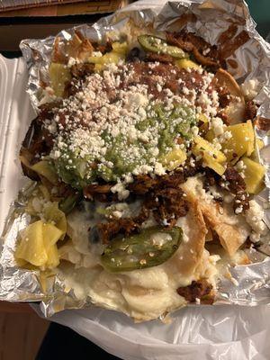 (Soy curl) Al pastor nachos to go without sour cream because I HATE sour cream