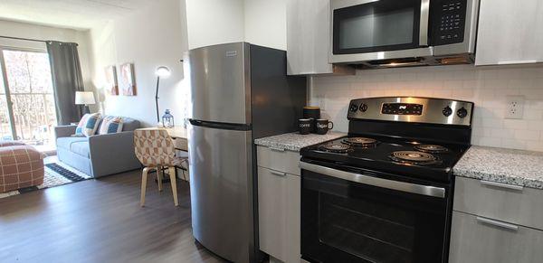 Modern galley kitchen with stainless appliances