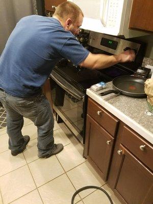 Chris hard at work on new stove!