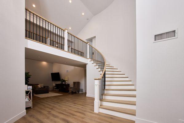 Solid White oak treads, 6084 handrail and black iron bars