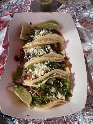 Two carne asada and two Al pastor tacos