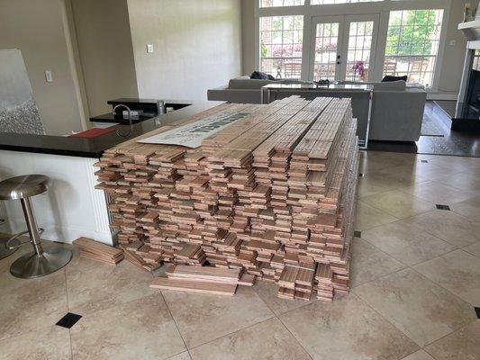 This is all the "work" that was done.  A pile of wood left in my foyer for months.  Justin Jones & Nortex Custom Hardwood Floors is a scam