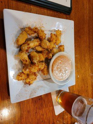 Cheese curds and a pint of alt.