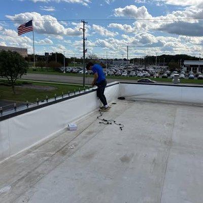 Hanging commercial holiday lights