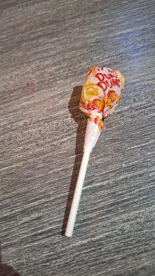 A dum dum lollipop for each of us with the check.