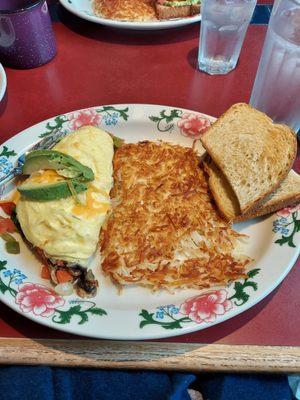 Vegetable omelet.  Hash browns and sour dough toast.