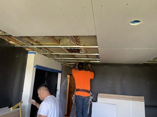 Safe N Sound insulation is added between ceiling joist with clips and channels, 2 layers of drywall with green glue and acoustic sealant.