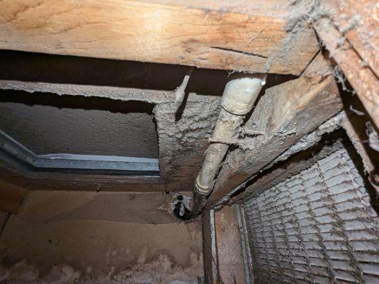 The pipe leaking under the AC condenser