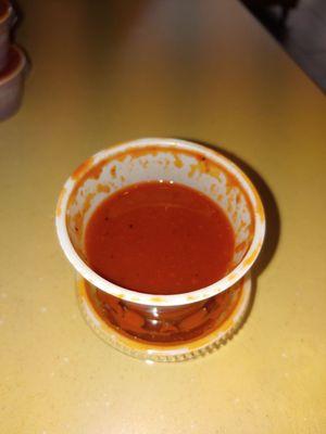 Red salsa... Needs salt.. Spicy but bland