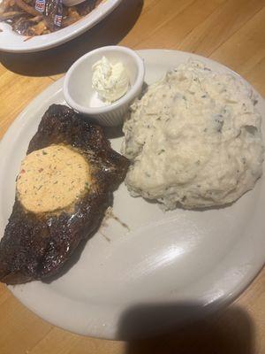 Cowboy sirloin with cajun butter and garlic mashed potatoes