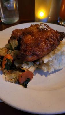 Brown Sugar Bourbon Fried Chicken with a vegetable medley of cabbage, kale and carrots on top of garlic mashed potatoes