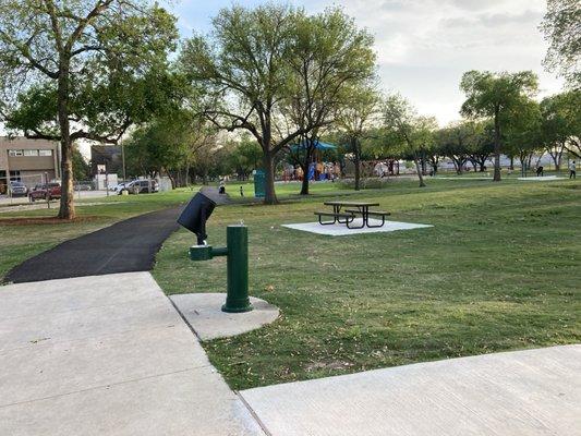 Picnic table and water fountain but no restroom.