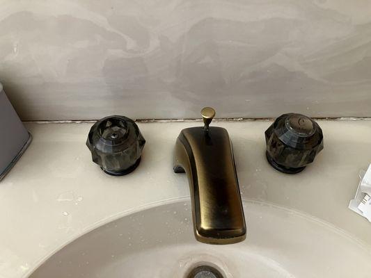 Moldy broken bathroom faucet