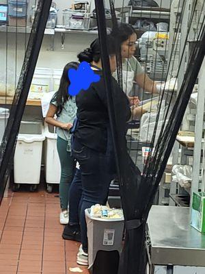 Child in kitchen around the food hair down not tied up....GROSS