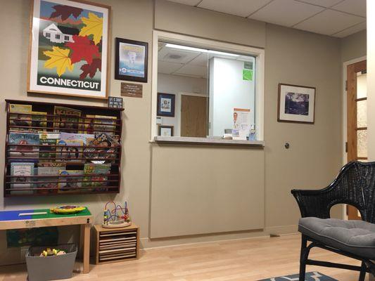 Reception desk with magazines and toys