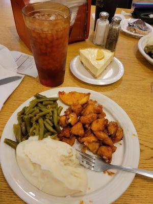 Orange chicken, green beans, Nash potatoes.