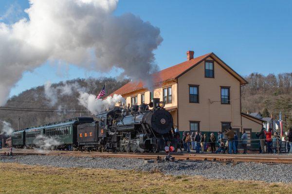 A steam powered excursion train arrives at the Orbisonia Station, ready to board another load of happy passengers!