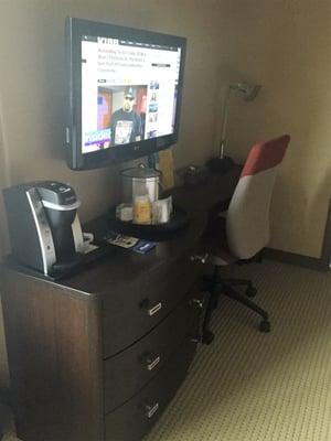 In room Keurig, tv and desk.