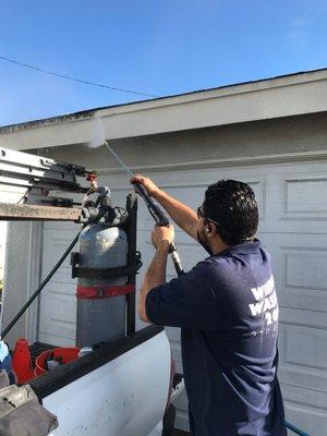 Pressure washing siding