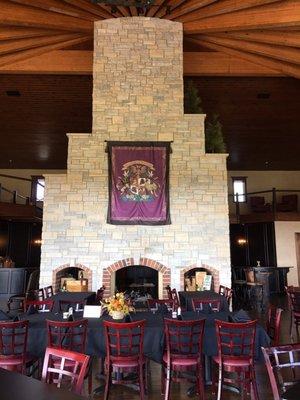 Giant stone fireplace in the main room.  (The bar and tasting bar are just behind the fireplace)