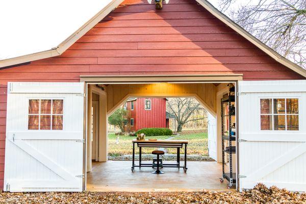 An outdated barn transformed into a Pottery Barn-inspired space, blending vintage charm with modern elegance.