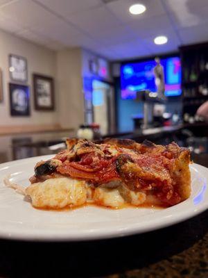 A slice from the small deep dish. So good!