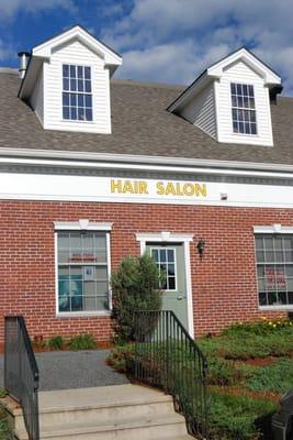 back door of salon facing Captain's Corner gas station