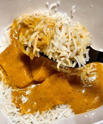 Chicken Tikka Masala over white rice sauce with white rice