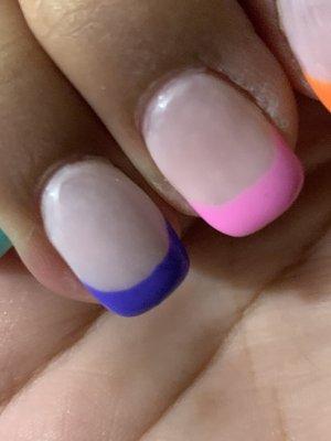 Purple nail is all thick and looks bubbly compared to the other nails