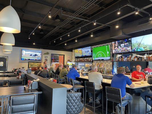 Bar area with lots of TV's completely full at 2:00pm on a Thursday